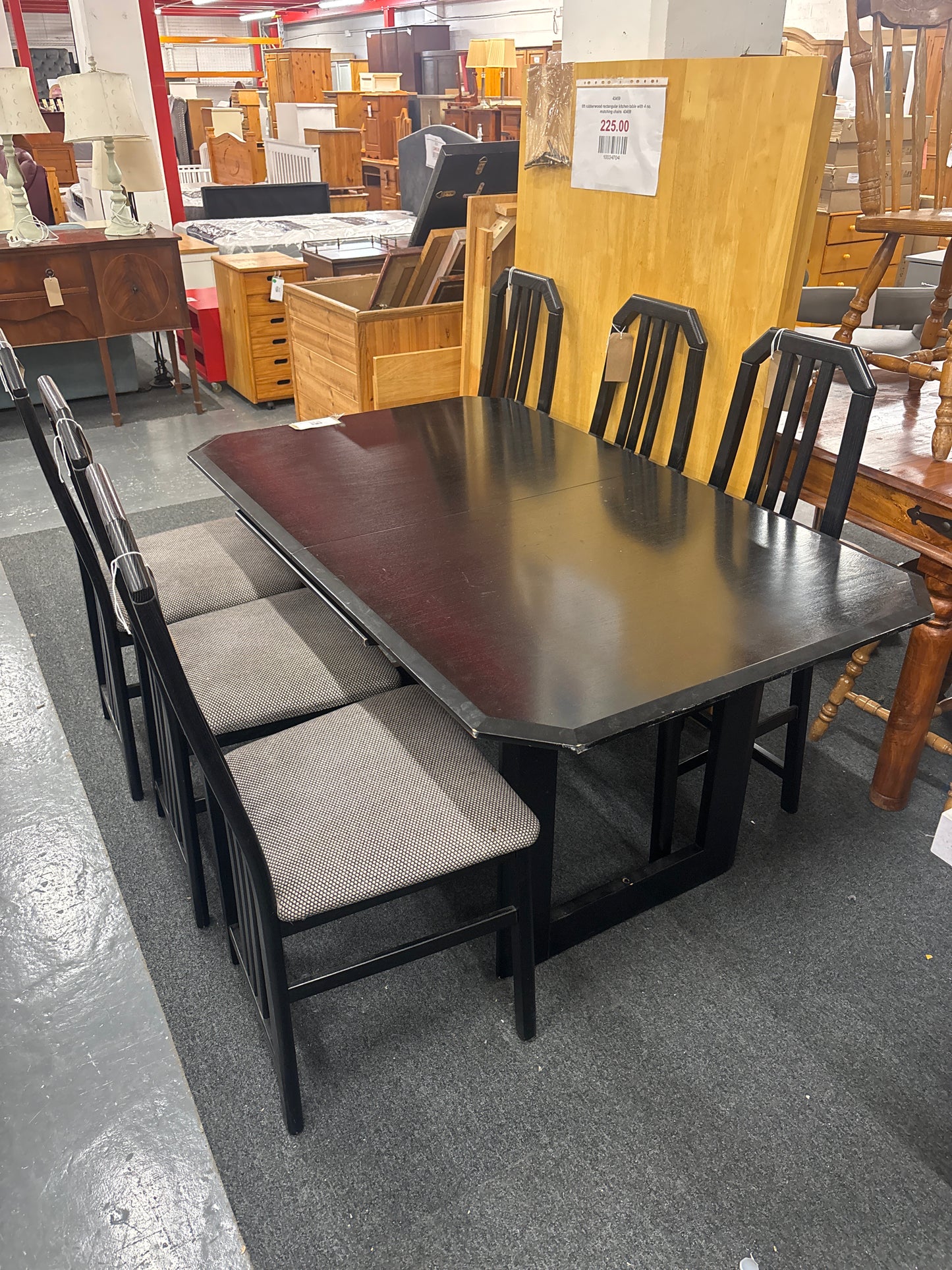 Black rectangular dining table and six matching chairs, good condition. 44028