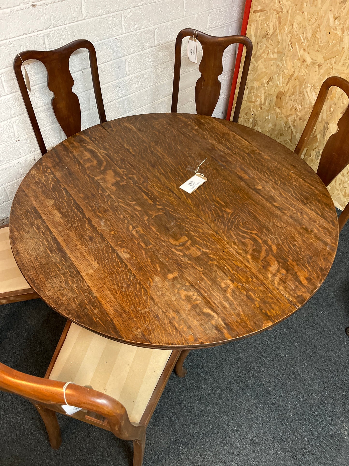 Stained oak circular table (H 78 x Diameter 123 cm) with high back stained oak dining chairs with striped cream seats 1325