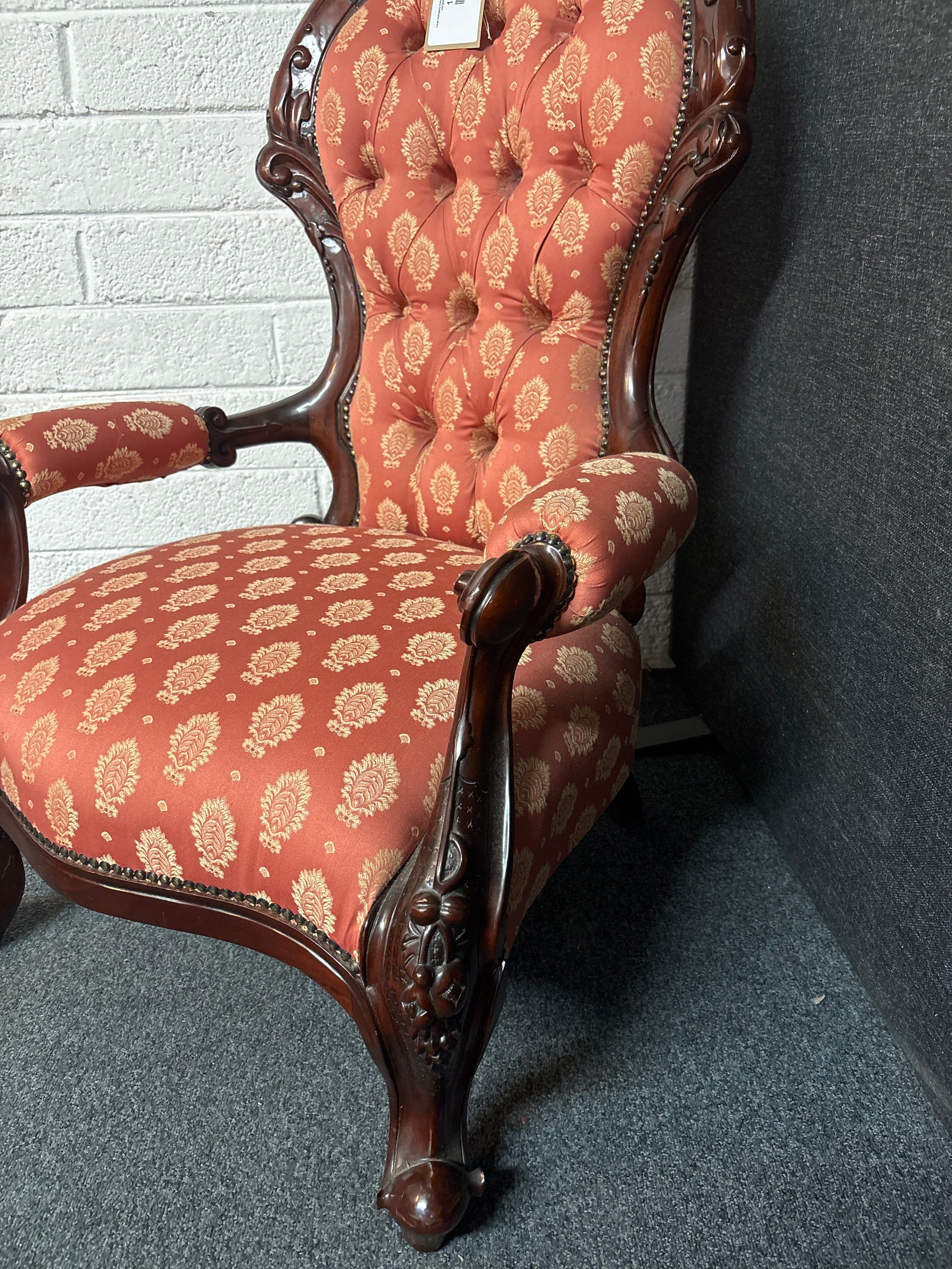 Large mahogany framed wing back armchair with wine and gold pattern fabric 3225