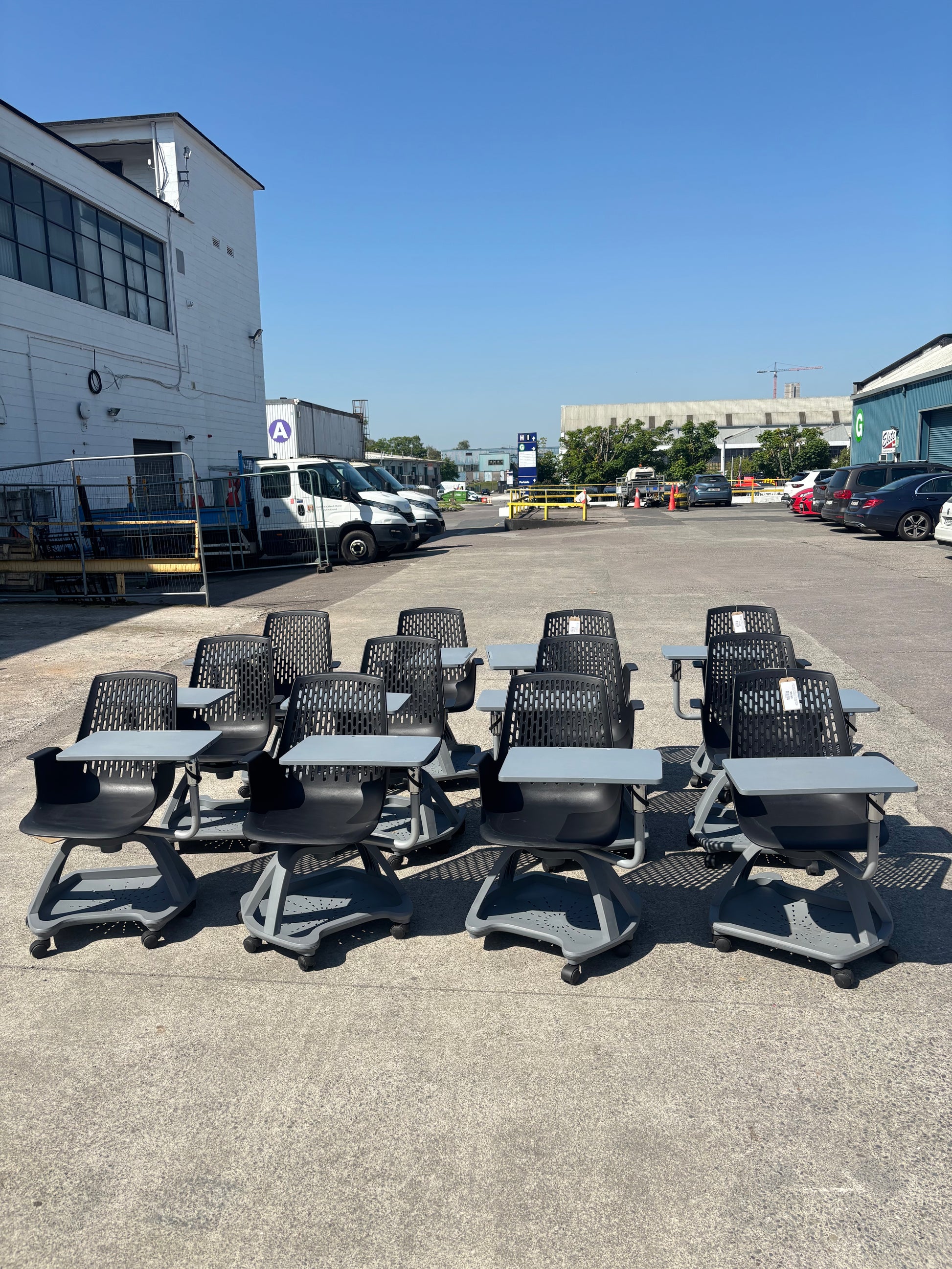 Report mobile conference chair with writing tablet on castors, black plastic seat, dark grey writing tablet with drinks holder. 90Hx64Wx59H. Seat height 445mm