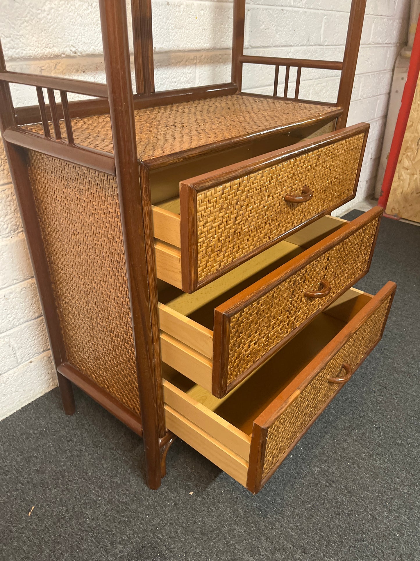 Tall dark cane framed 3 drawer open fronted shelf unit (H 187 x W 69 x D 36 cm) 1325
