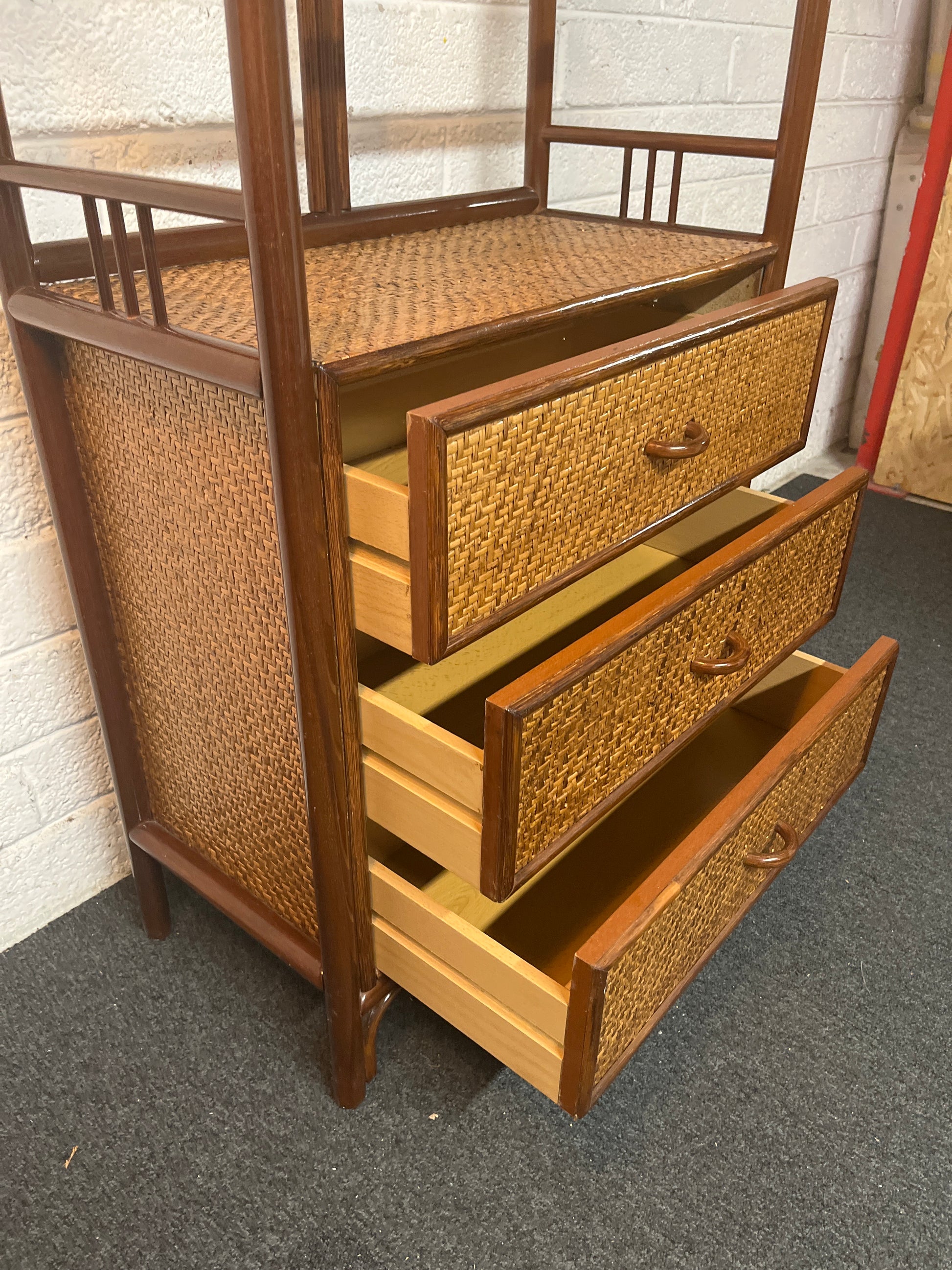 Tall dark cane framed 3 drawer open fronted shelf unit (H 187 x W 69 x D 36 cm) 1325