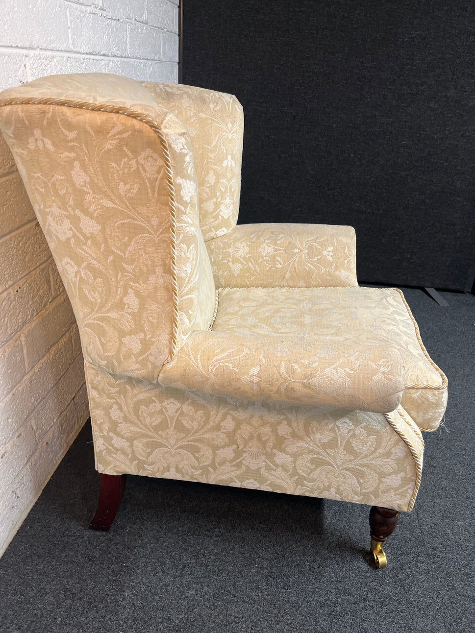 Cream mix fabric Queen Anne armchair solid wood frame, brass castors. 2225