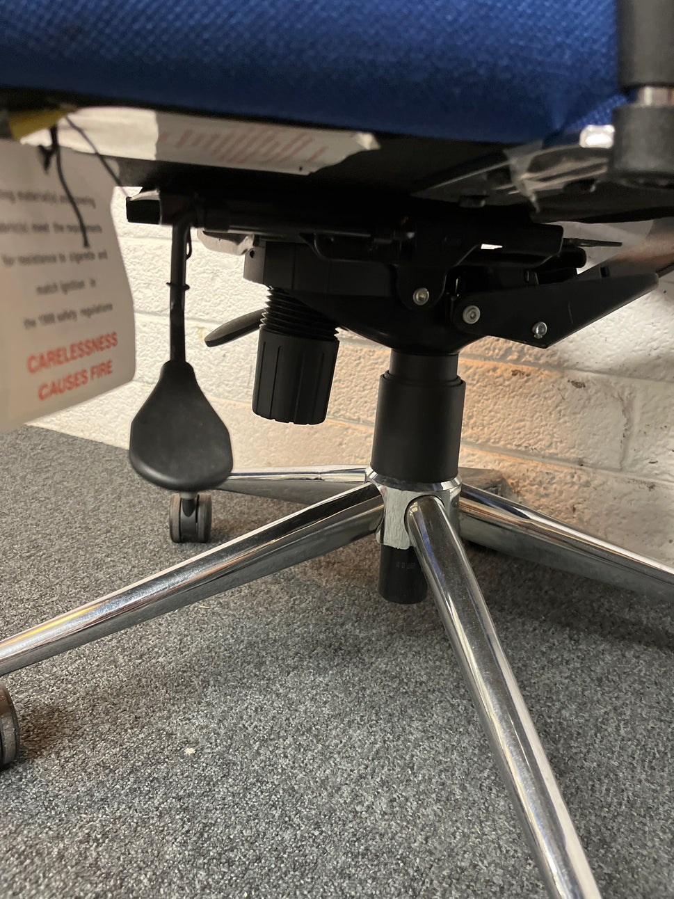 Secondhand High back, dark blue fabric swivel chair, heavy duty with polished chrome base and height adjustable arms and back tensioner . PRICE INC VAT, 20+ IN STOCK