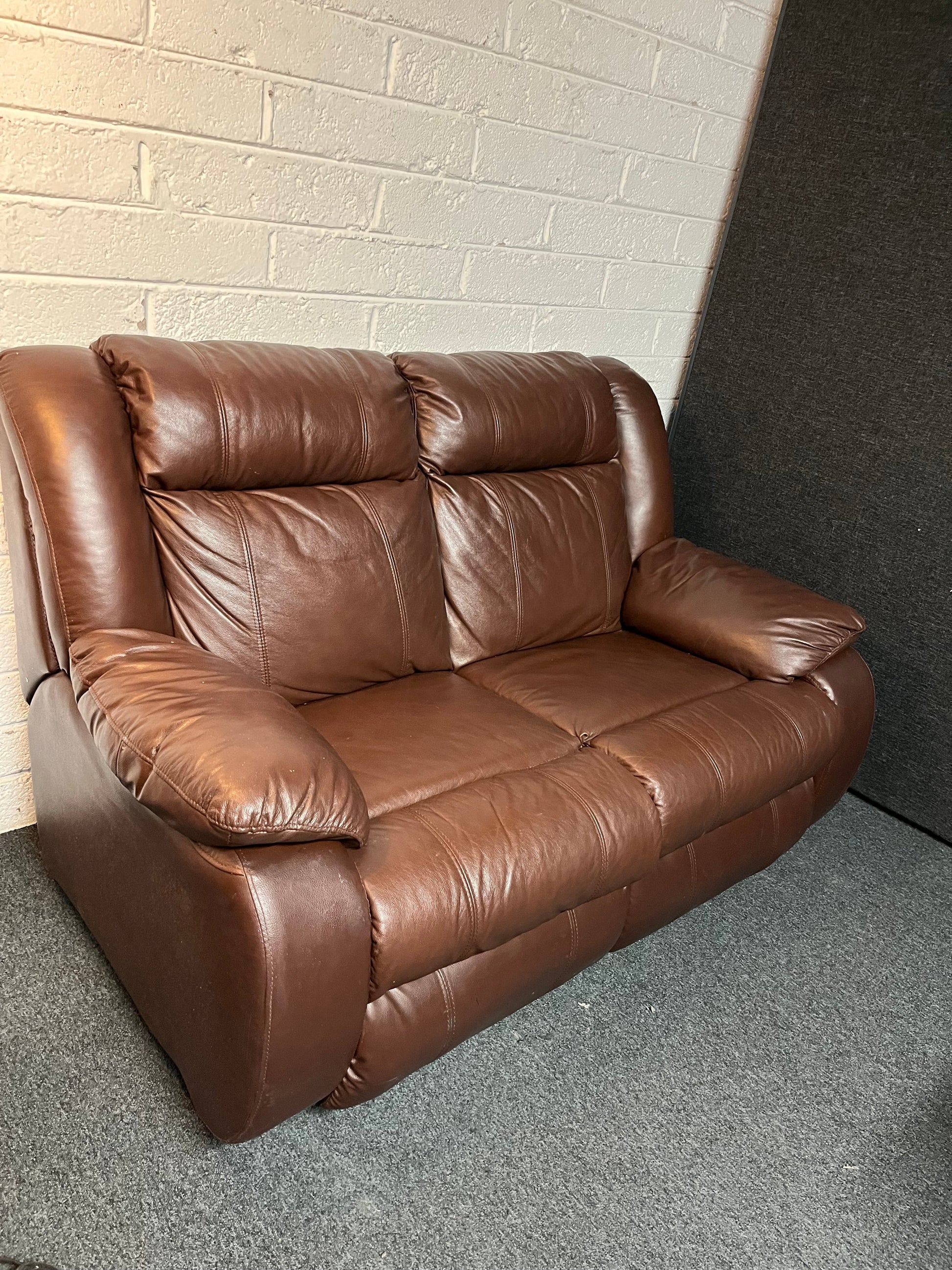 Dark brown leather 2 seater and matching rocking recliner armchair 2225