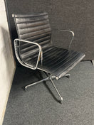 Switch Eames style black leather low back swivel chair with polished chrome base on pads or castors 2 image