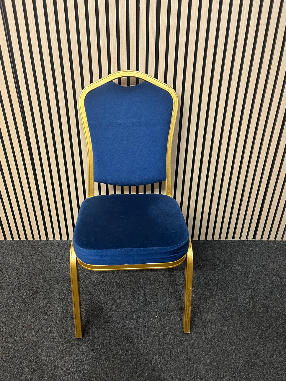 Blue fabric metal framed gold effect stacking banquet chair with curved top