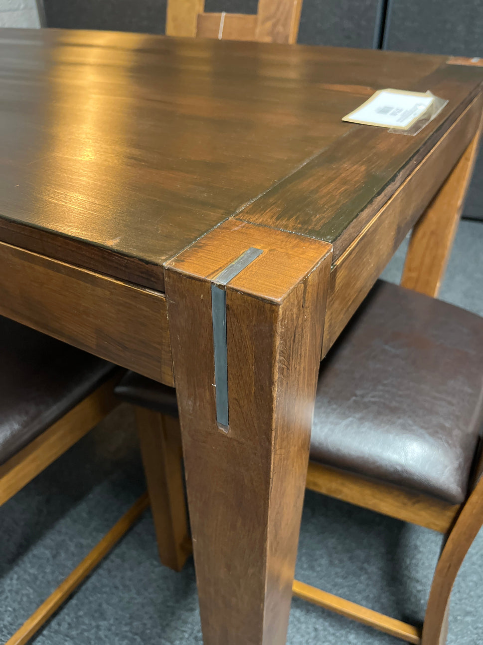 Solid  dark wood stained kitchen table (W 1200 x L 750 mm) with 4 no. solid wood chairs with black leatherette seat cushion 1225