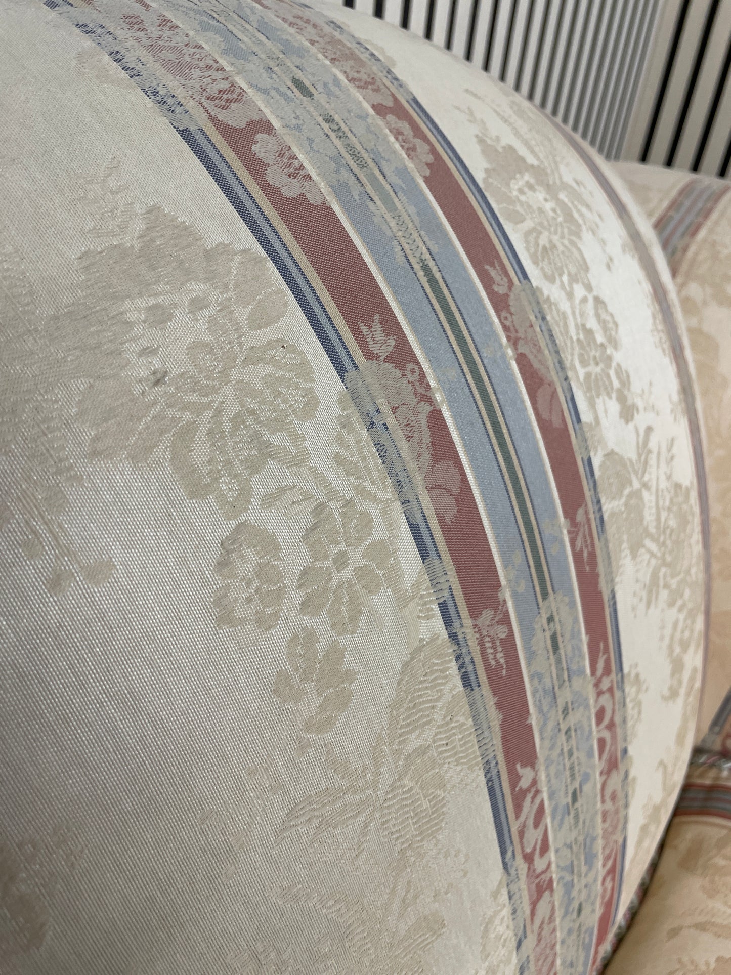 Ornate roll back stripped fabric armchair with castors 2425