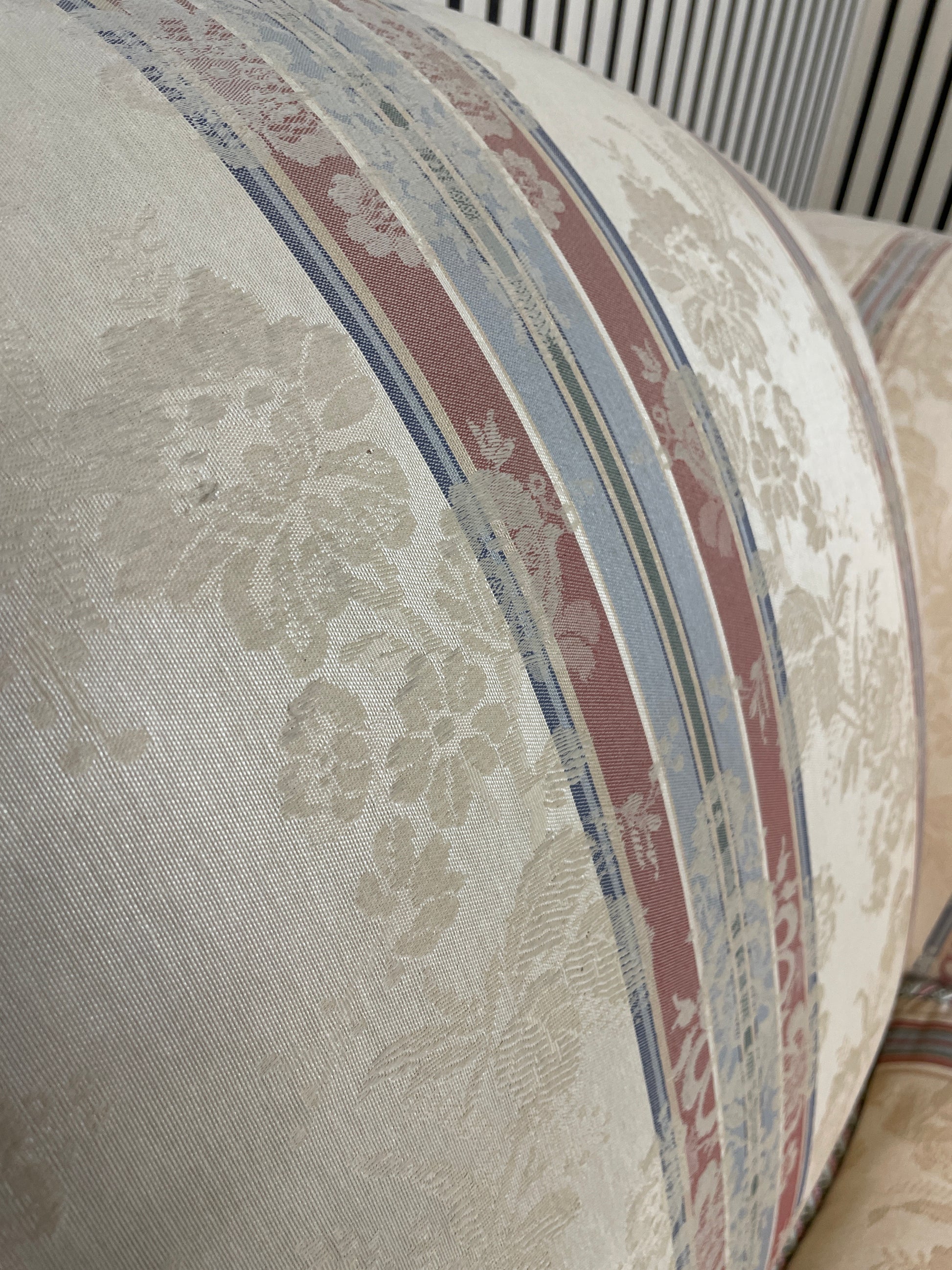 Ornate roll back stripped fabric armchair with castors 2425