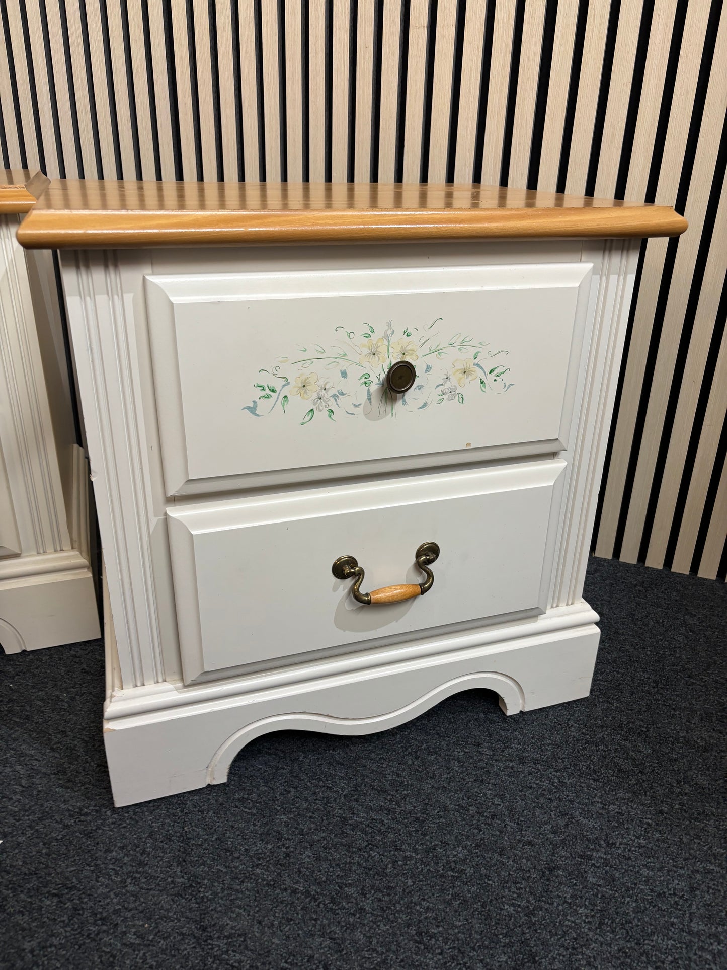 White nightstand with floral detailing and two drawers