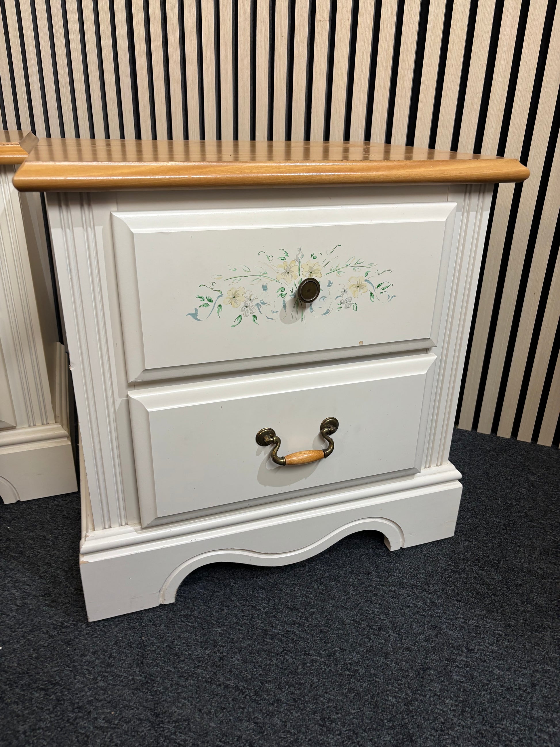 White nightstand with floral detailing and two drawers
