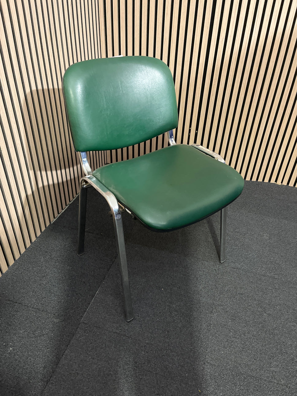 Green vinyl stacking meeting chair, chrome frame