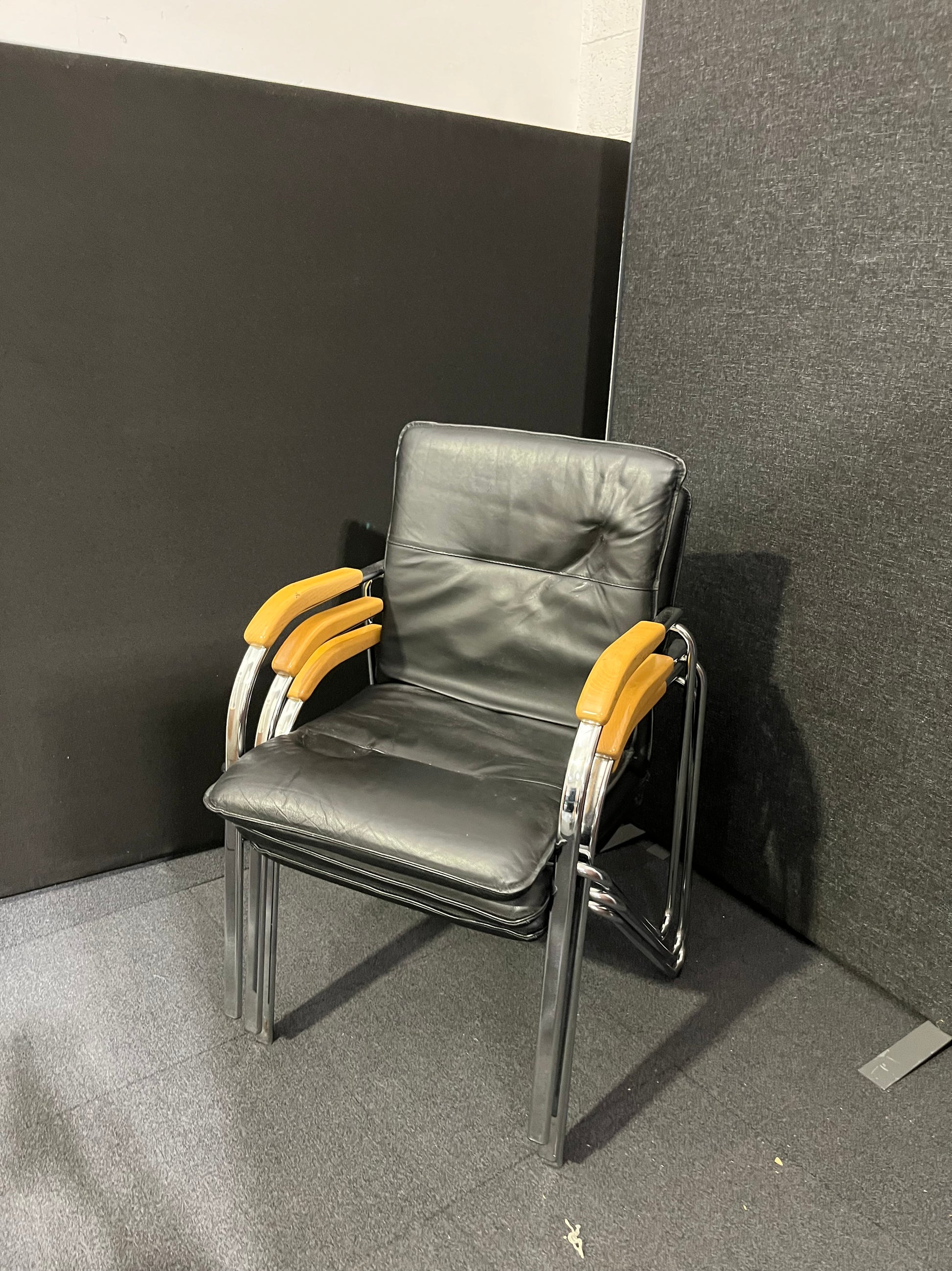 Black leatherette chrome framed stacking chair with wooden arms  1425
