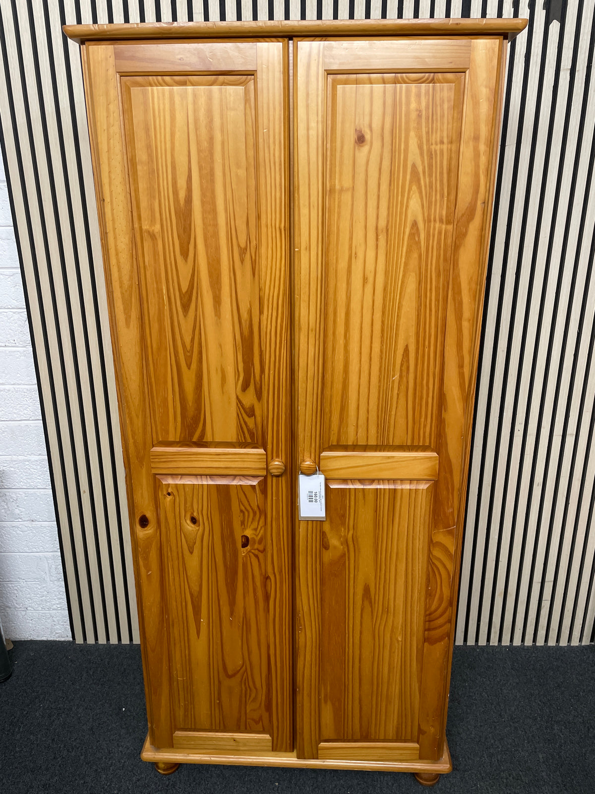 Two-door solid pine wardrobe with traditional recessed panel detailing.  44412
