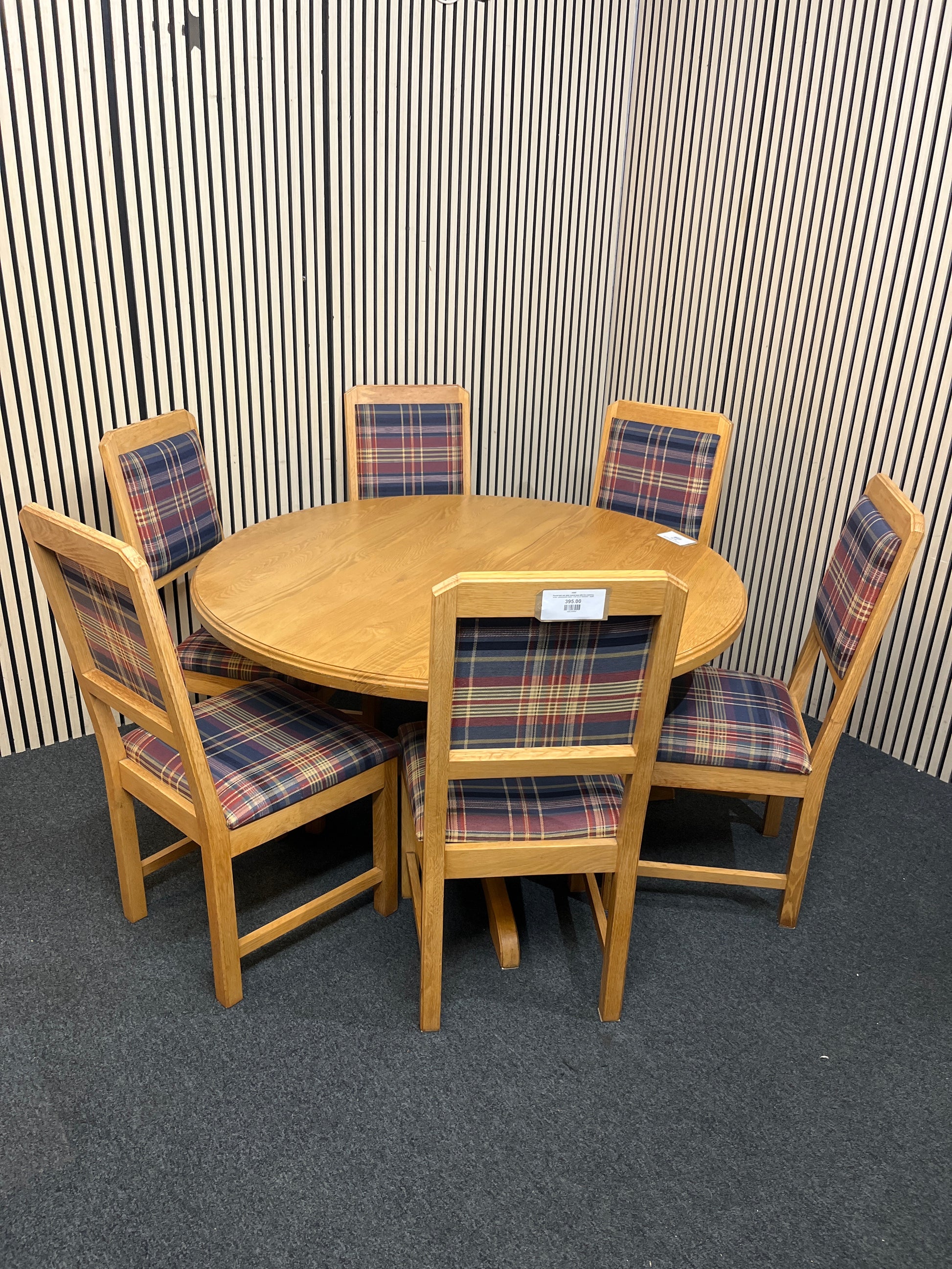 Round light oak table central base with five matching tartan upholstered chairs. (135 cm in diameter)  44285