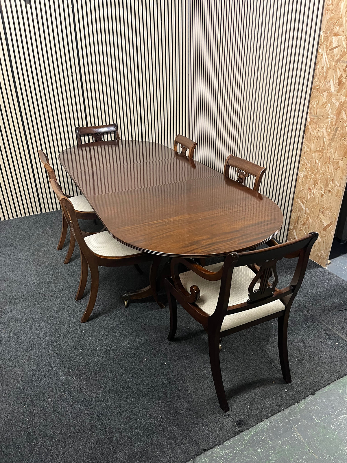 Mahogany dining set including oval pedestal table and six chairs.  44369
