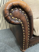Two-seater sofa with leather frame, fabric cushions, and stud detailin W190x100D  44492