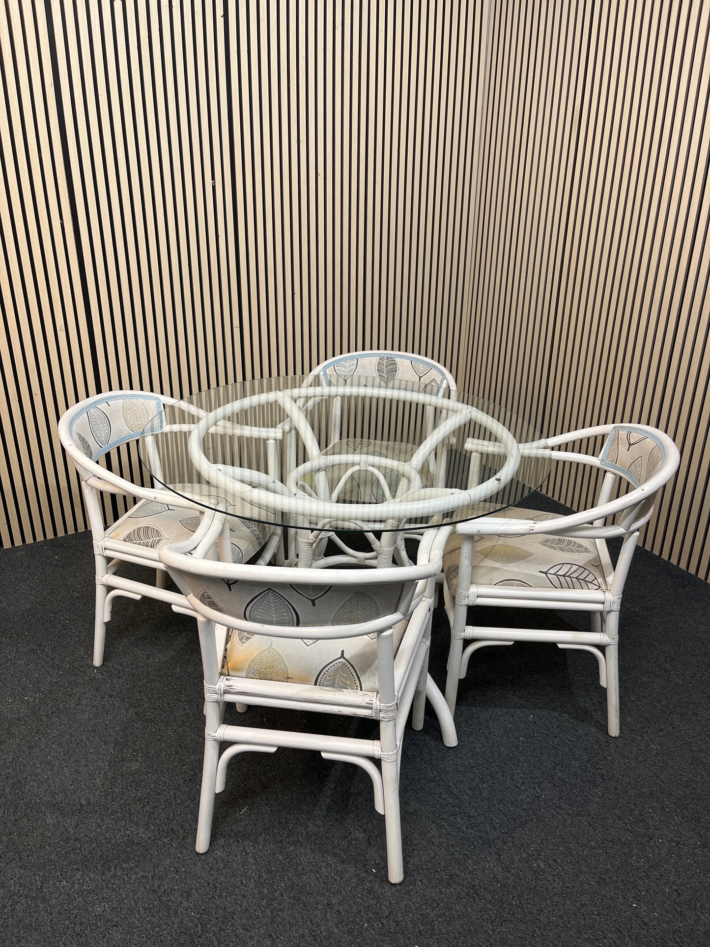 White painted cane, circular glass top conservatory table (110 cm diameter) with 4 no chairs 1126