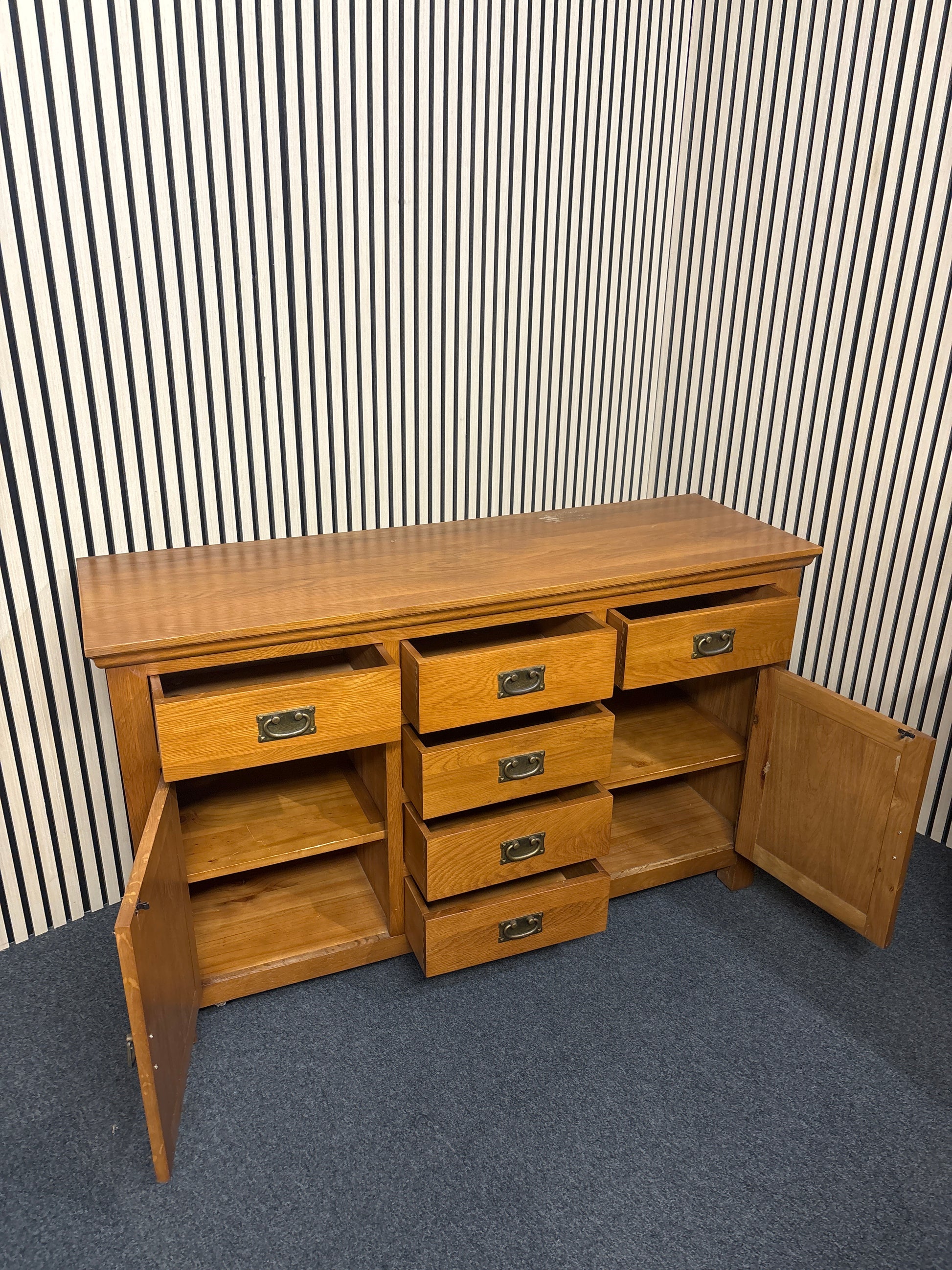 Solid oak stained 2 door 6 drawer sideboard(L x 140 W x 45 H x 85 cm) 3325
