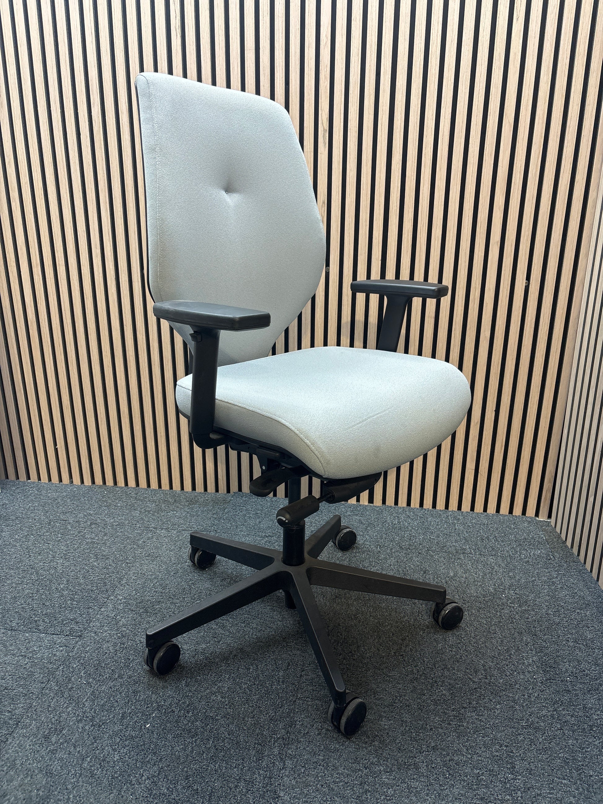 Grey secondhand fabric swivel chair with adjustable arms and 5 star swivel base