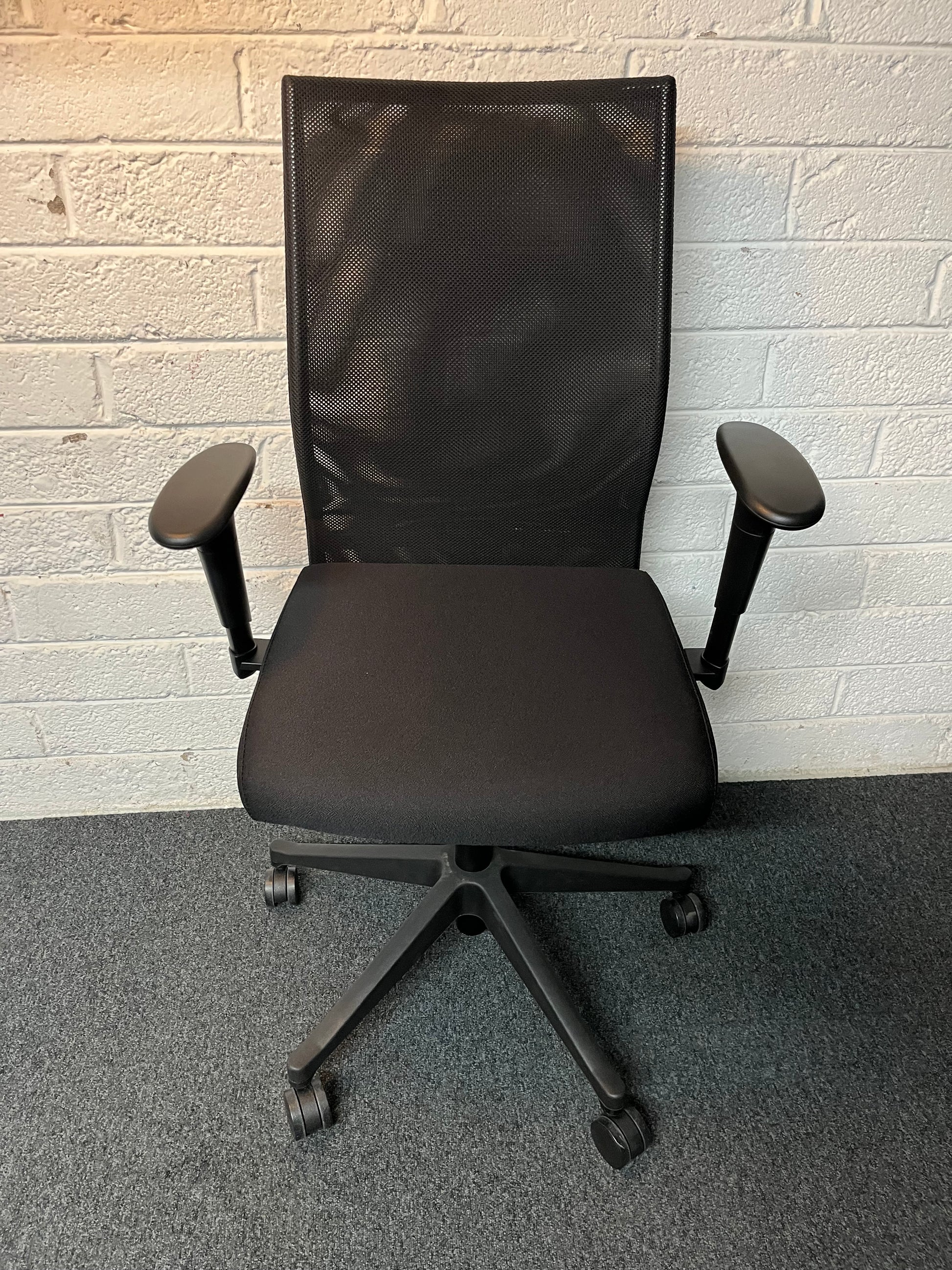 SECONHAND Black fabric seat, black mesh back swivel chair with multifunction and height adjustable arms. IN EXCELLENT CONDITION