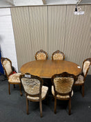 Switch Ornate dark wood dining table with central column base 6 matching darkwood framed floral fabric seats  2325 2 image