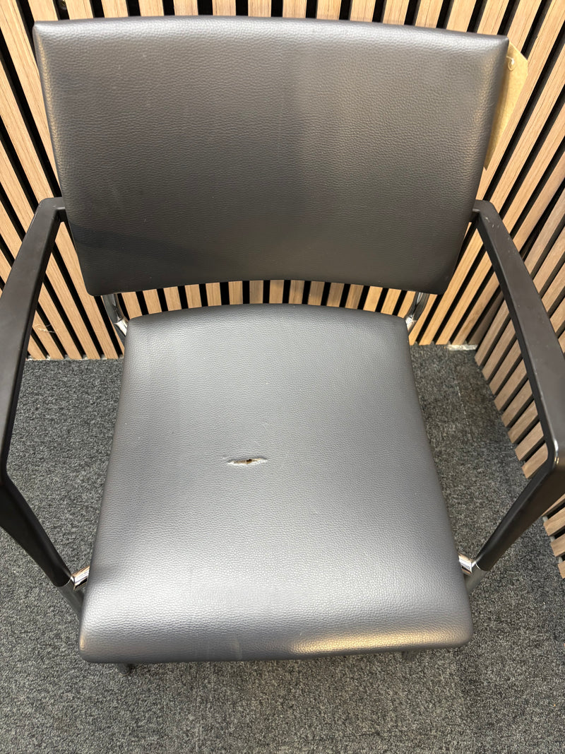 Black pu leatherette stacking chair with arms