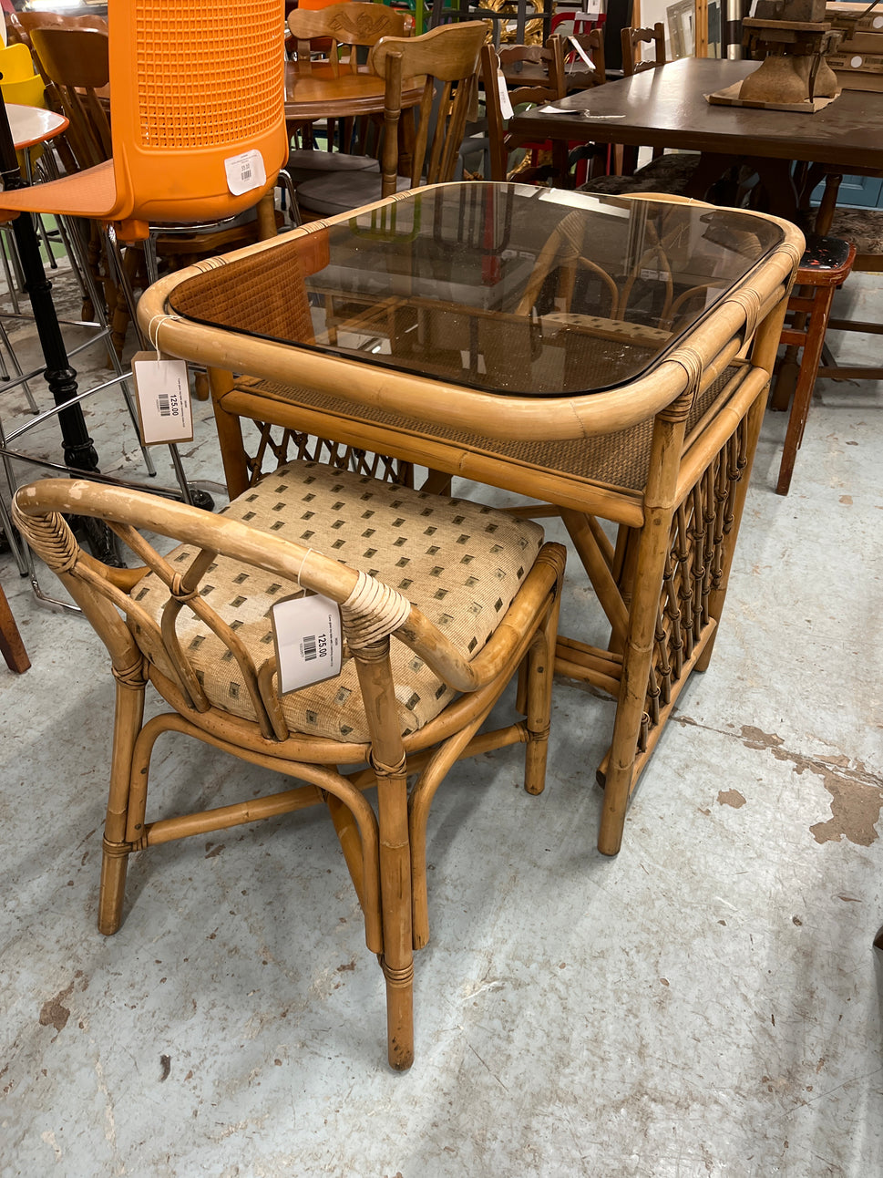 Cane glass top table with 2 matching chairs 2125