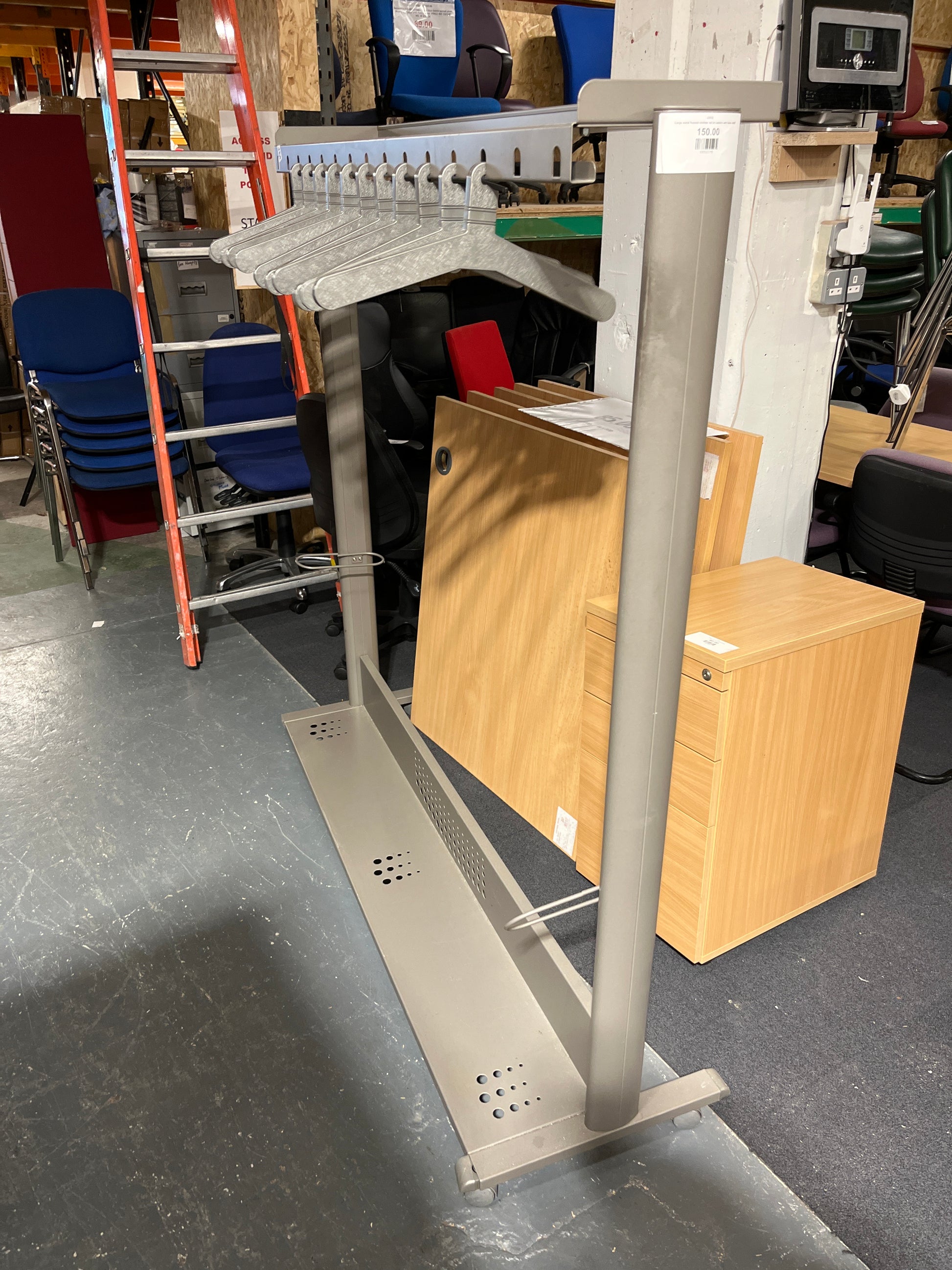 Large metal framed clothes rail on castors with base shelf