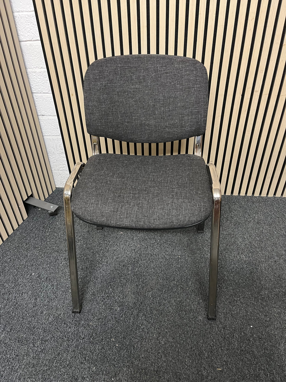 Chrome framed, charcoal fabric seat and back, stacking chair