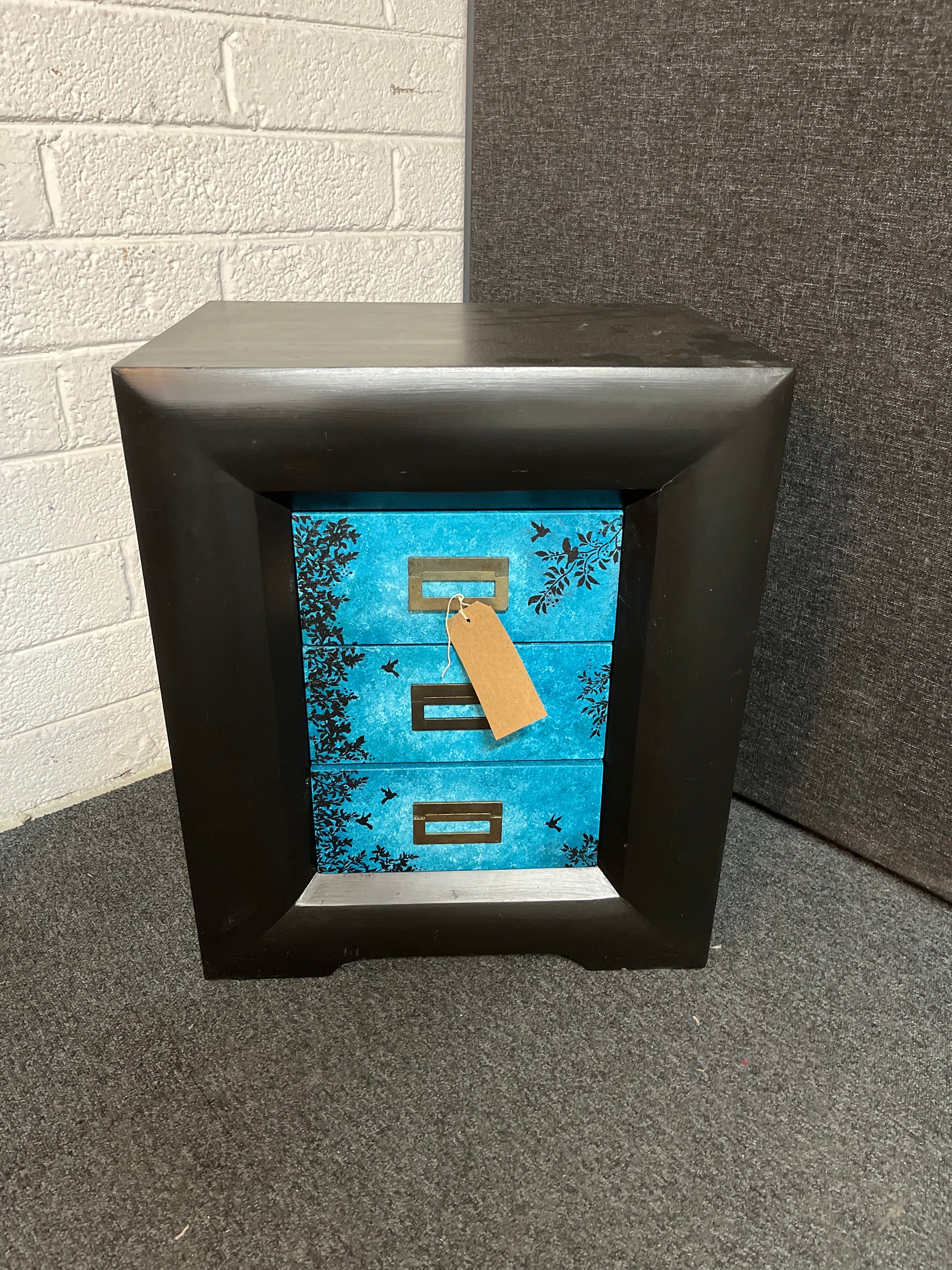 Black painted large 3 drawer bedside locker with blue floral detailing on the drawers 3225
