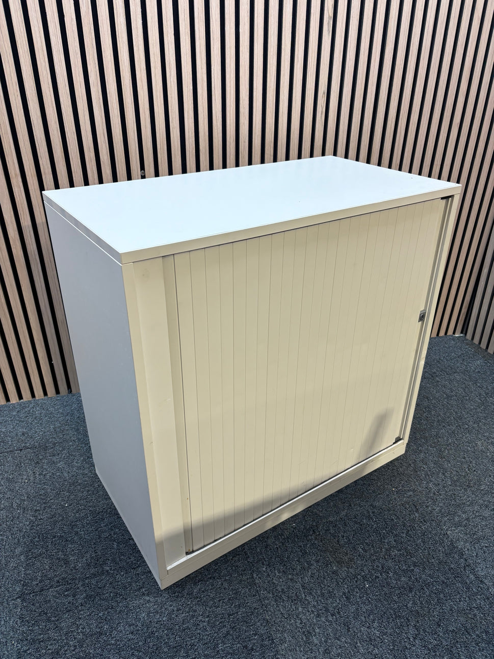 White wooden tambour unit with storage shelf and sliding door (H 79 x W 80 x D 43 cm)