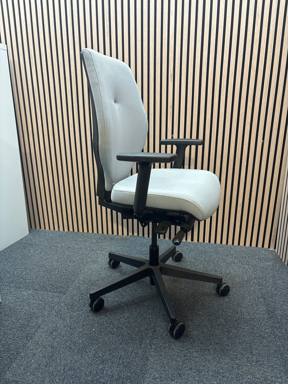 Grey secondhand fabric swivel chair with adjustable arms and 5 star swivel base