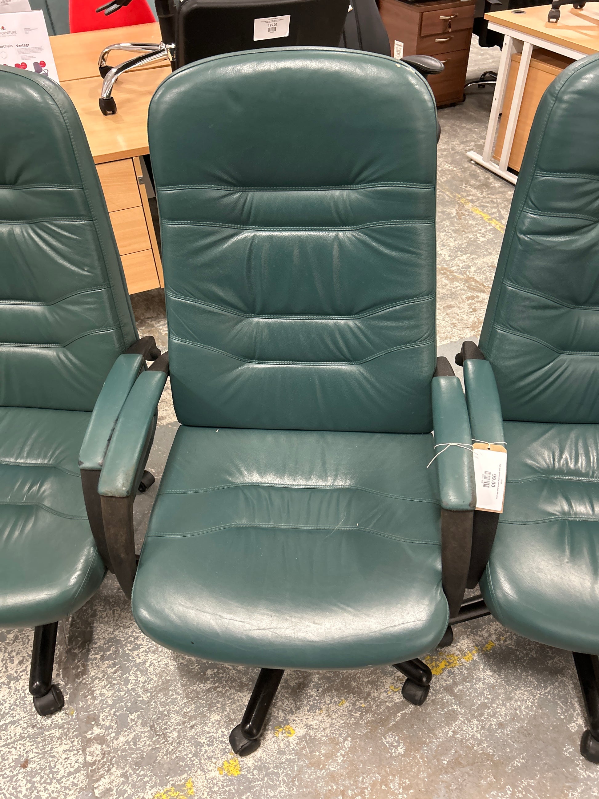 High back green leather swivel chair with arms