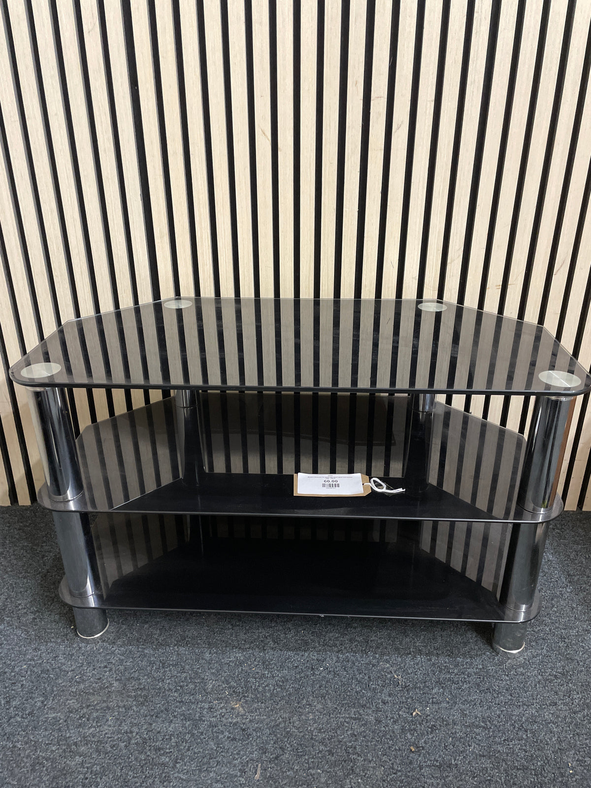 Modern three-tier TV stand with black glass and chrome legs.  44416