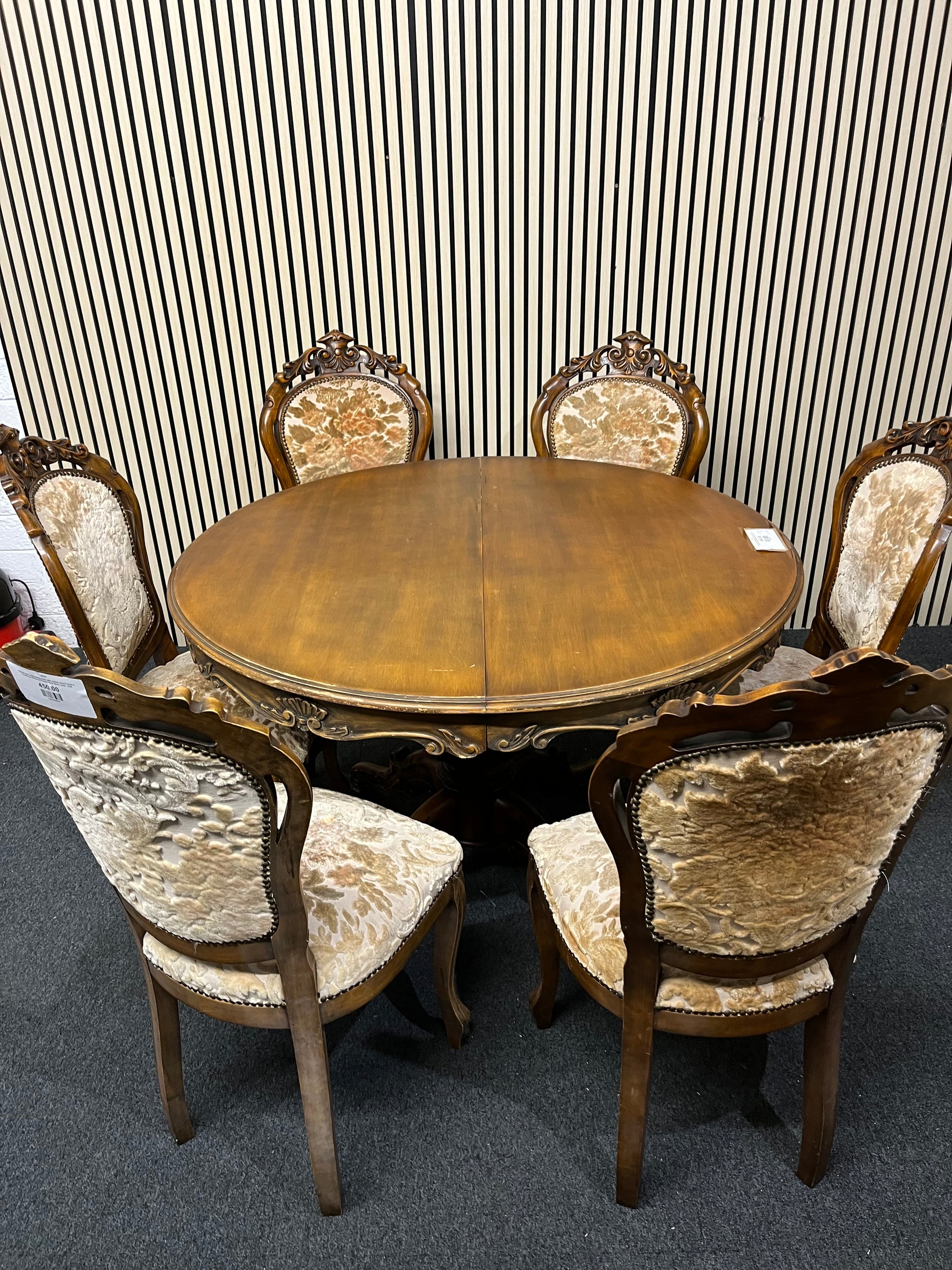 Ornate dark wood dining table with central column base 6 matching darkwood framed floral fabric seats  2325