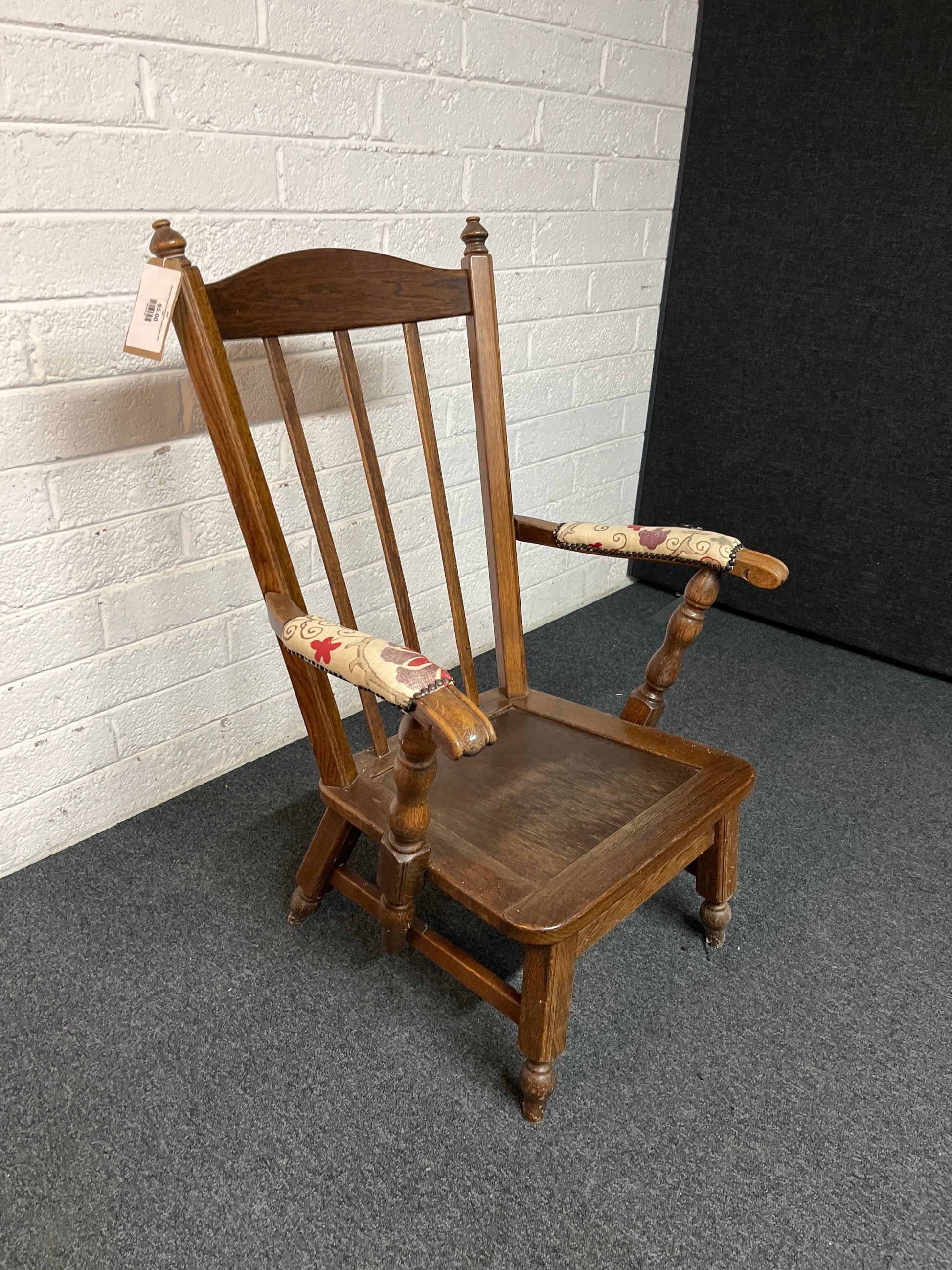 Dark wood stained armchair with padded fabric arms  2225