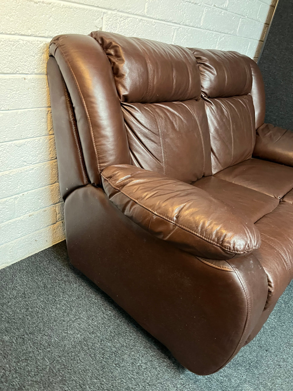 Dark brown leather 2 seater and matching rocking recliner armchair 2225