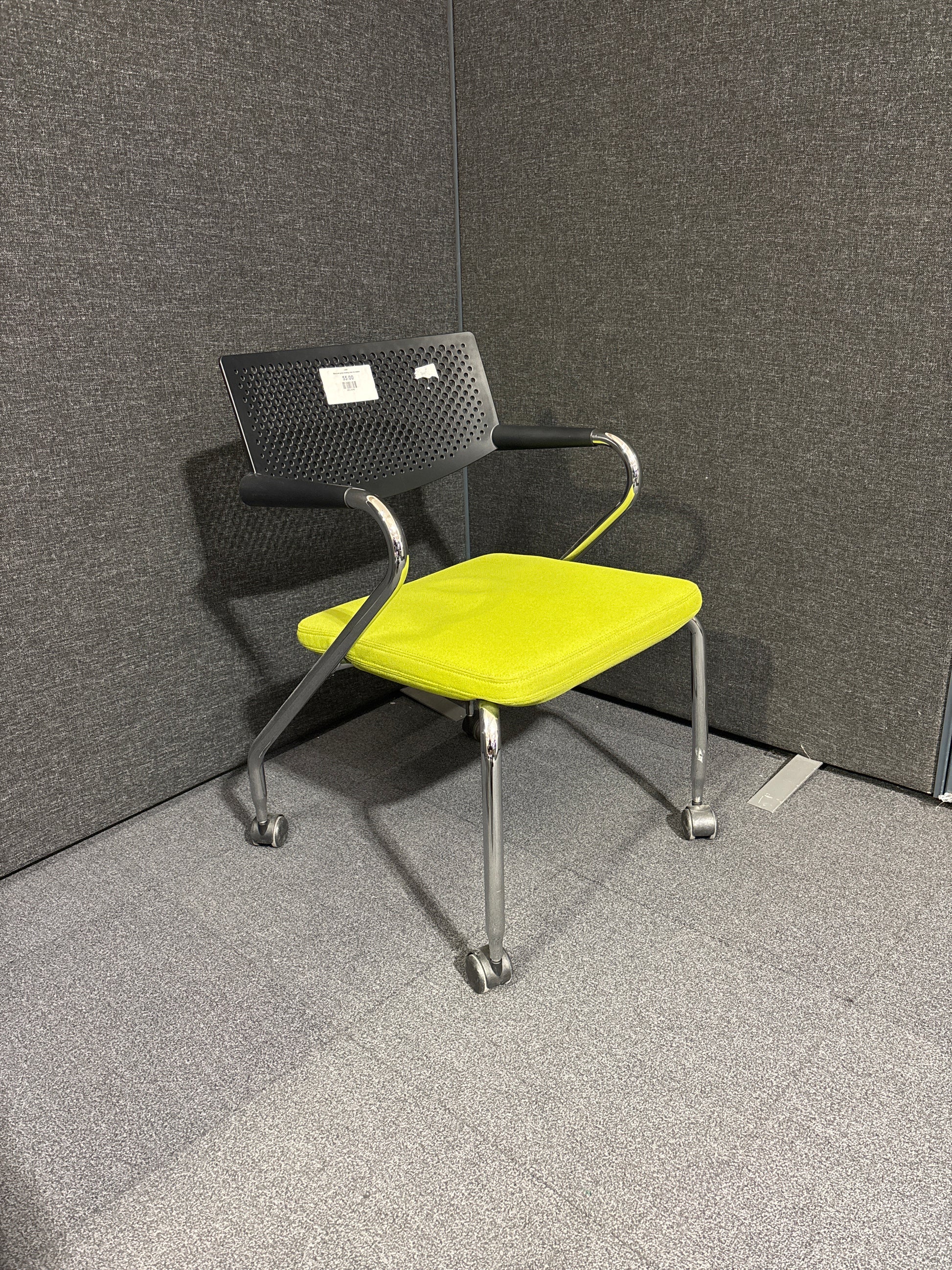 Black and green meeting chair on castors