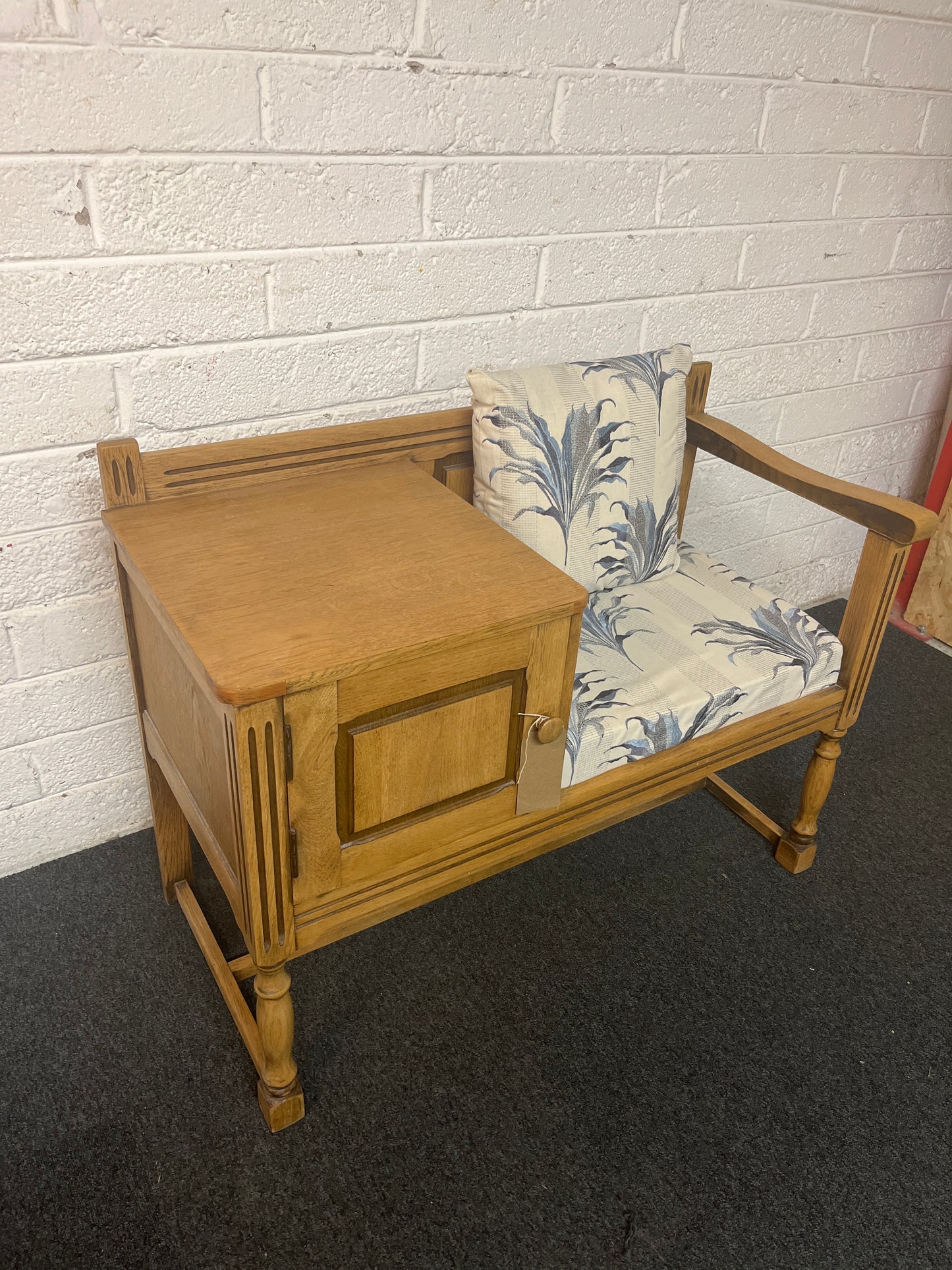 Oak telephone table with blue and cream floral fabric seat and storage drawer 1325