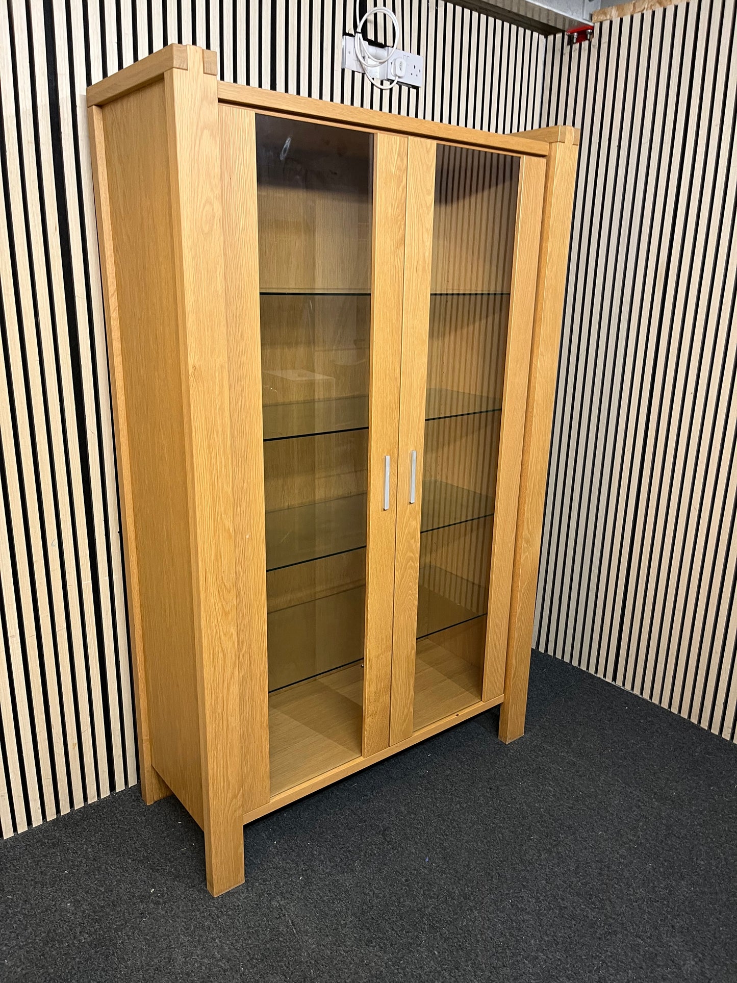 Two-tier wooden display unit with sliding glass panels, good condition. (H 195 x W 119 x D 49 cm)  44241