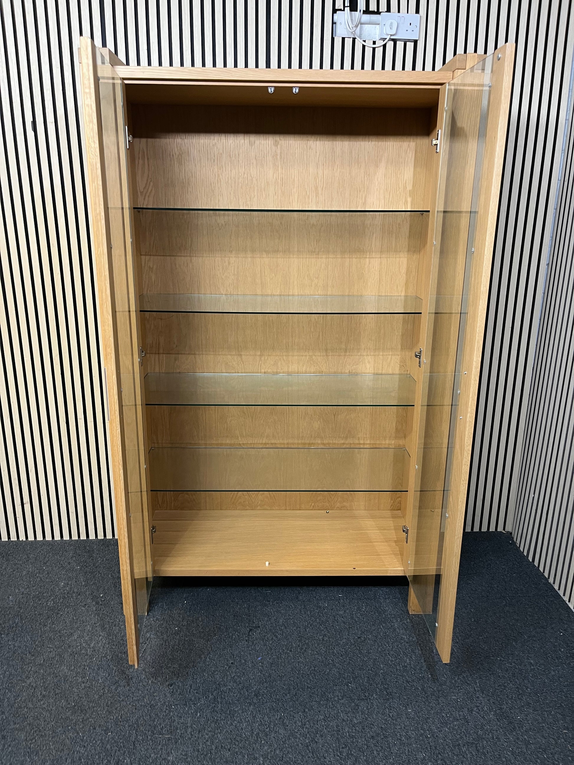 Two-tier wooden display unit with sliding glass panels, good condition. (H 195 x W 119 x D 49 cm)  44241