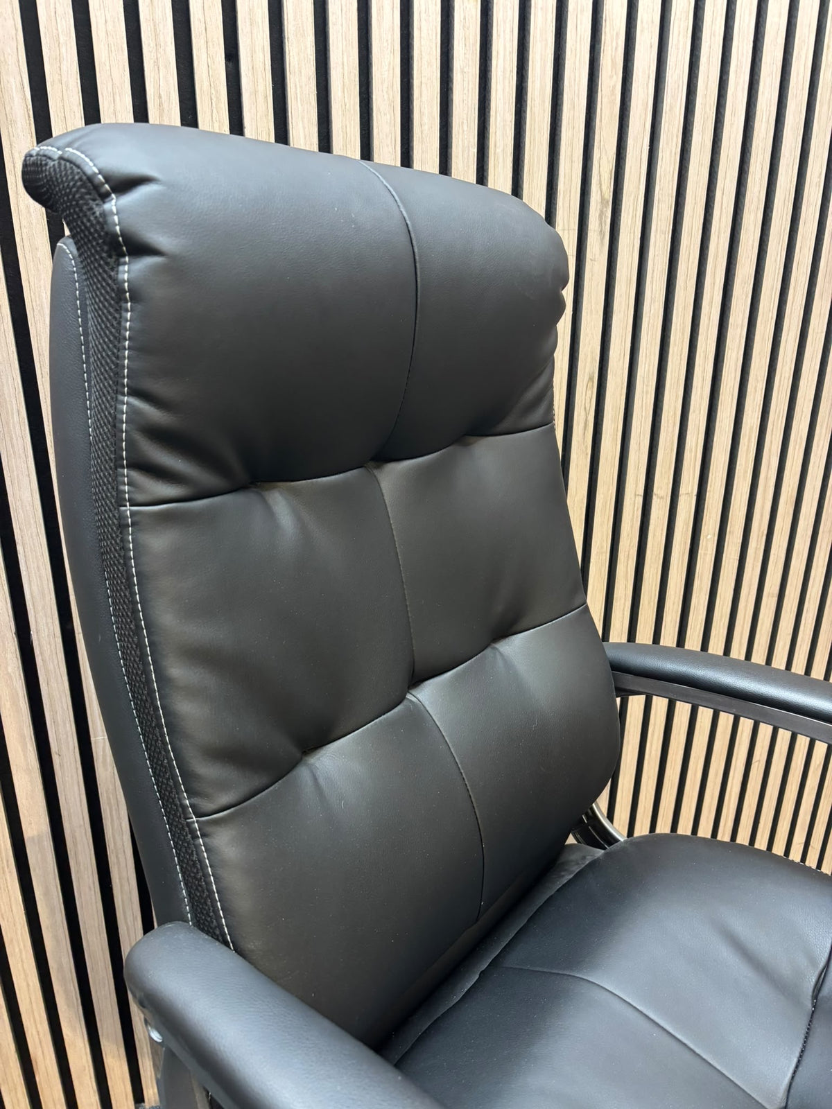 Padded black faux leather executive swivel chair, high back with arms  J3950