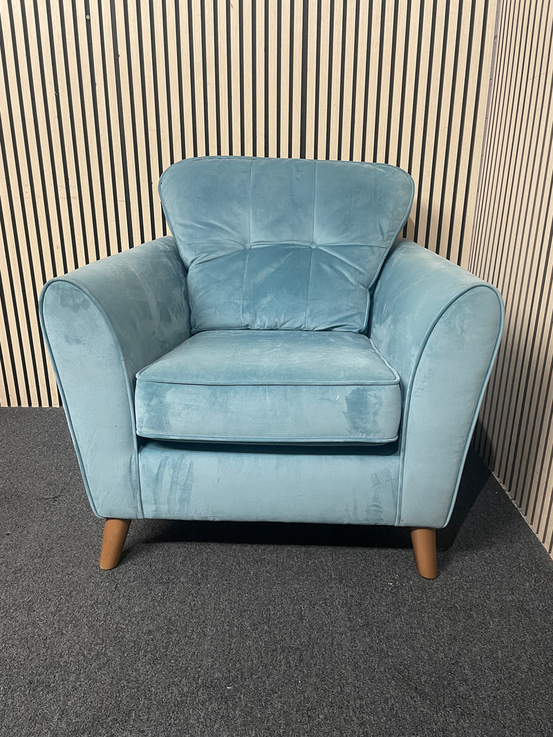 A modern duck egg blue velvet armchair with piped edges.  44696