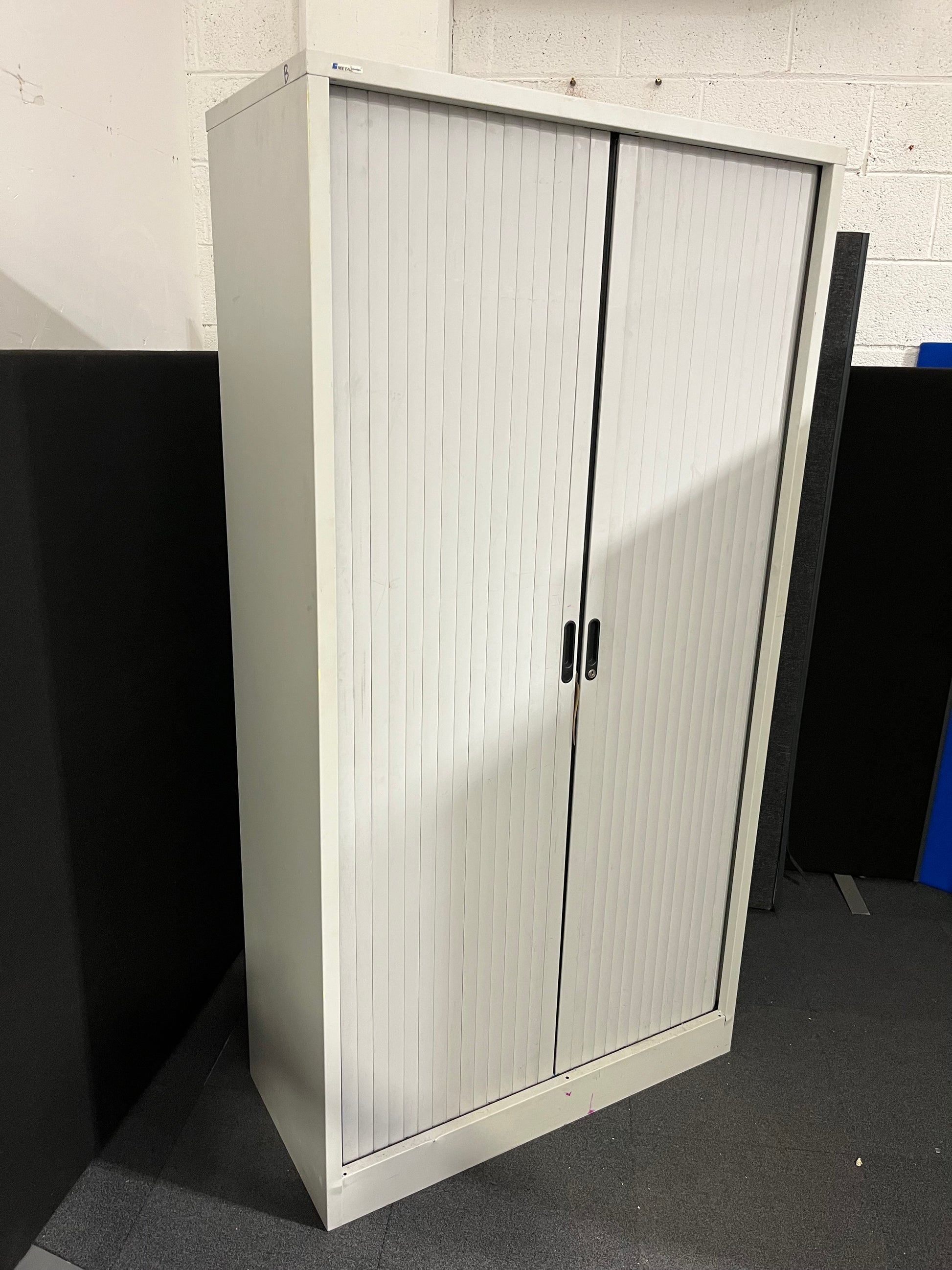 Tall 2 door sideopen metal tambour unit, grey metal frame with grey plastic sliding doors with internal shelves 190Hx100x450D 1425