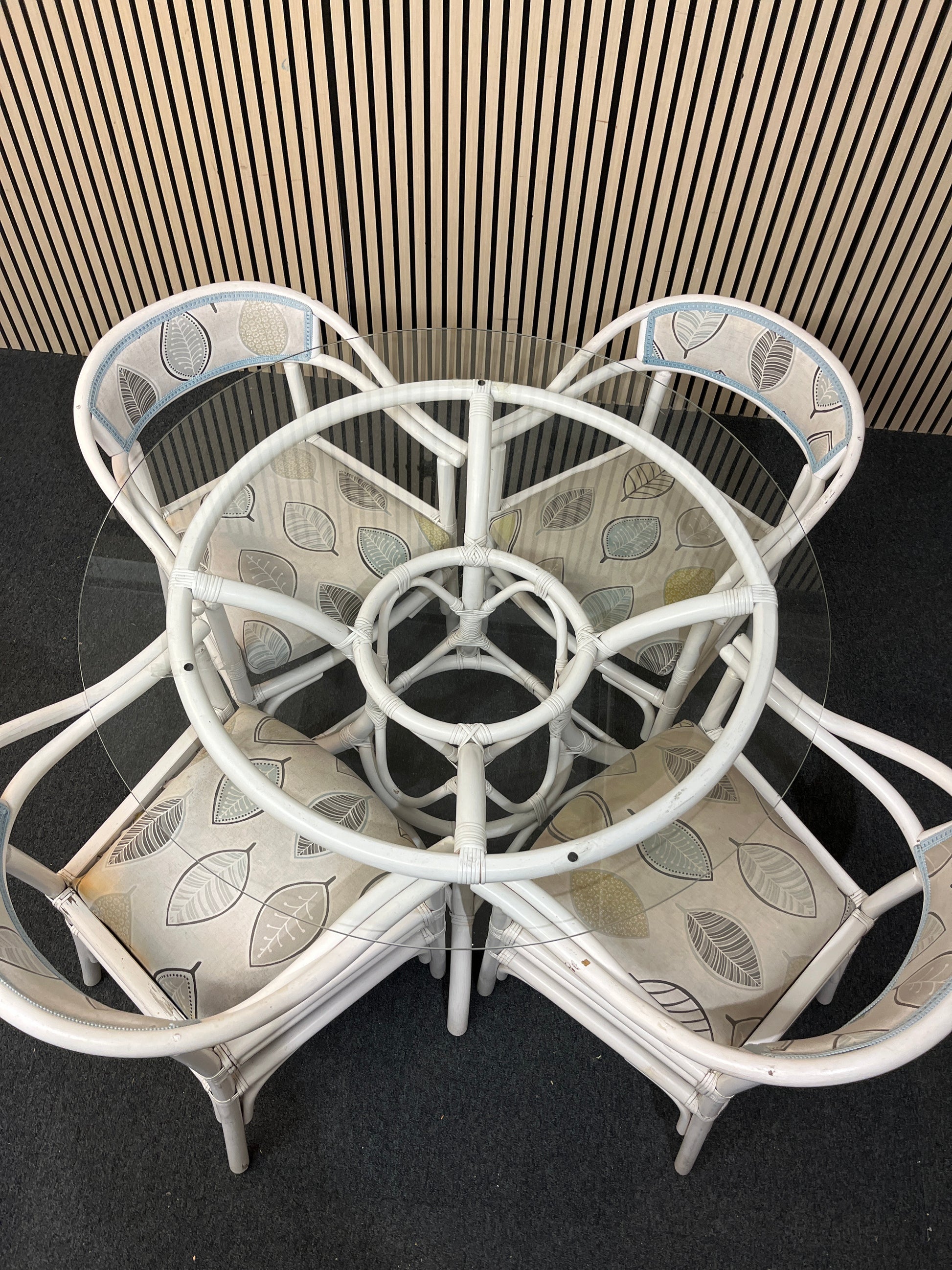 White painted cane, circular glass top conservatory table (110 cm diameter) with 4 no chairs 1126