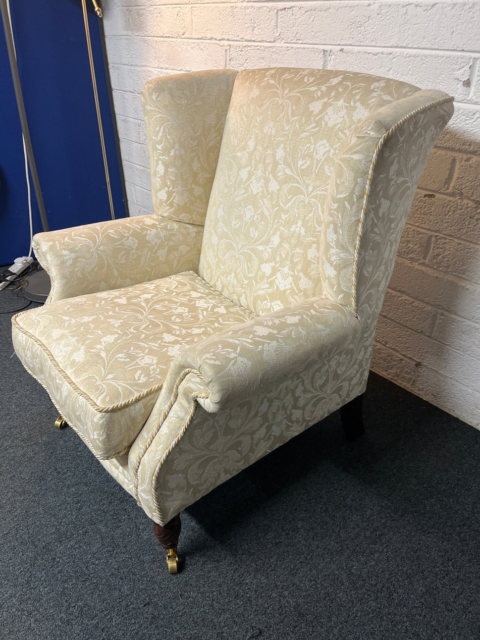 Cream mix fabric Queen Anne armchair solid wood frame, brass castors. 2225
