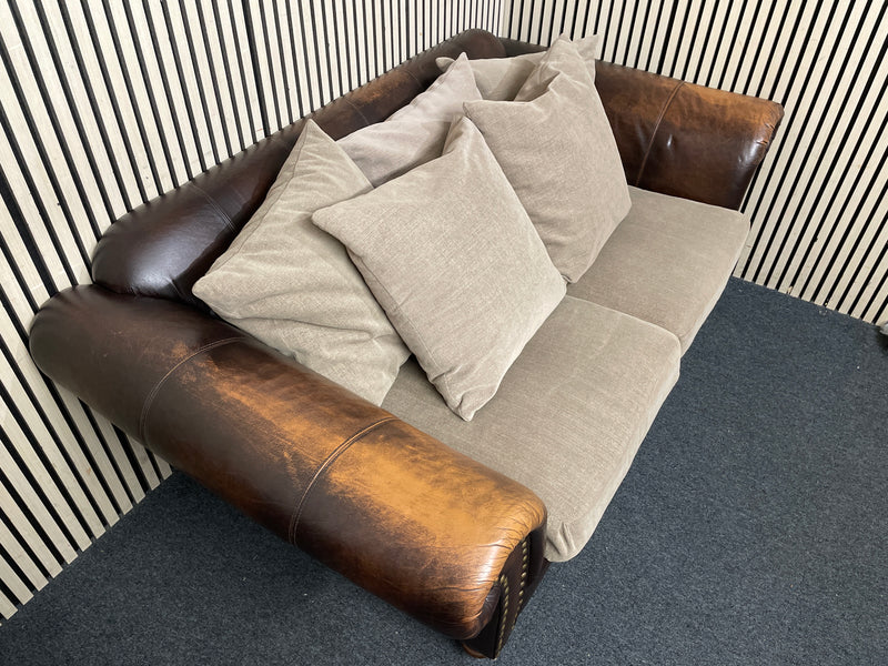 Two-seater sofa with leather frame, fabric cushions, and stud detailin W190x100D  44492