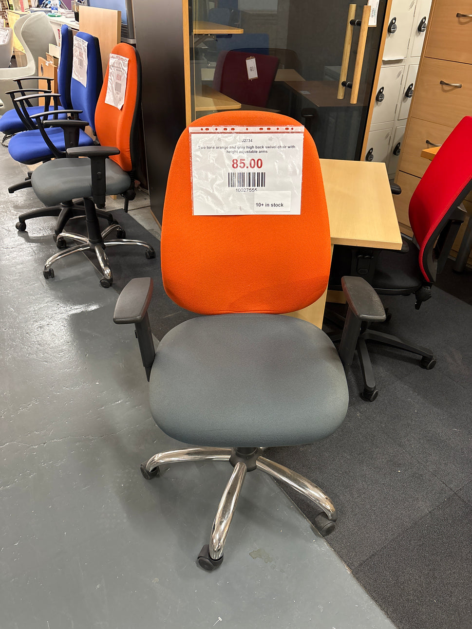 Two tone orange and grey high back swivel chair with height adjustable arms